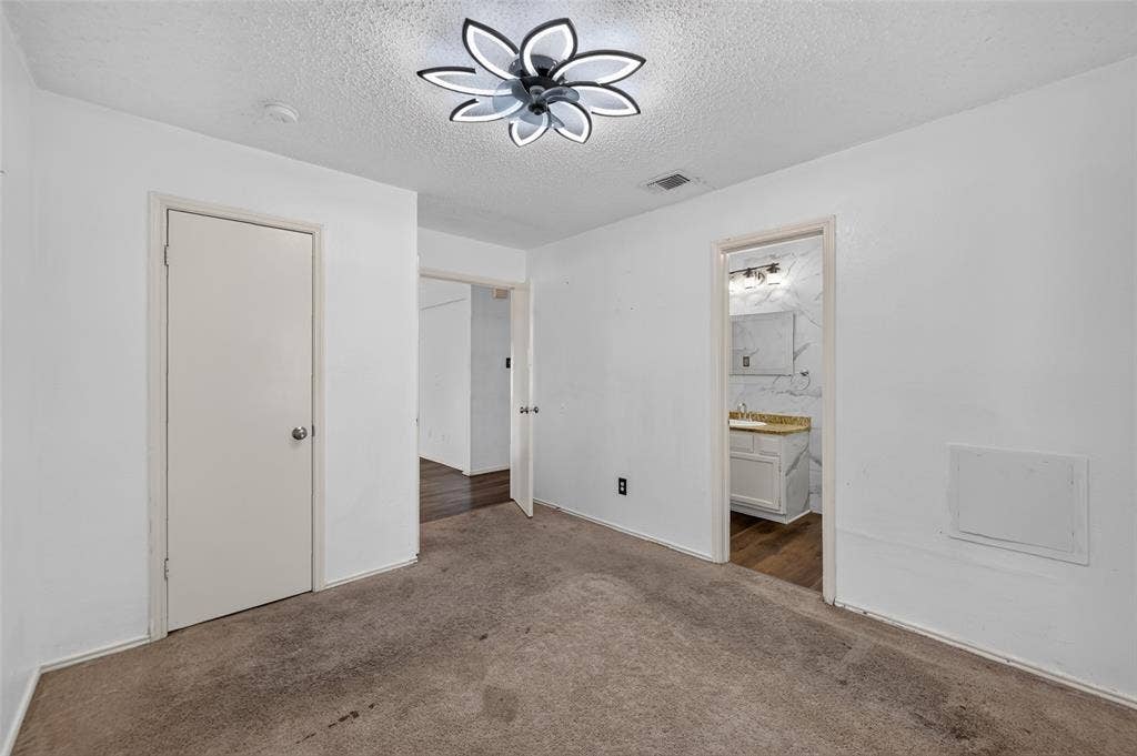 583 Kirkland Drive, Coppell, TX 75019 White walls, carpeted flooring, and a contemporary ceiling light fixture