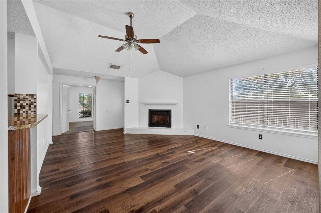 583 Kirkland Drive, Coppell, TX 75019 Wood-finish flooring, vaulted ceiling, and a ceiling fan