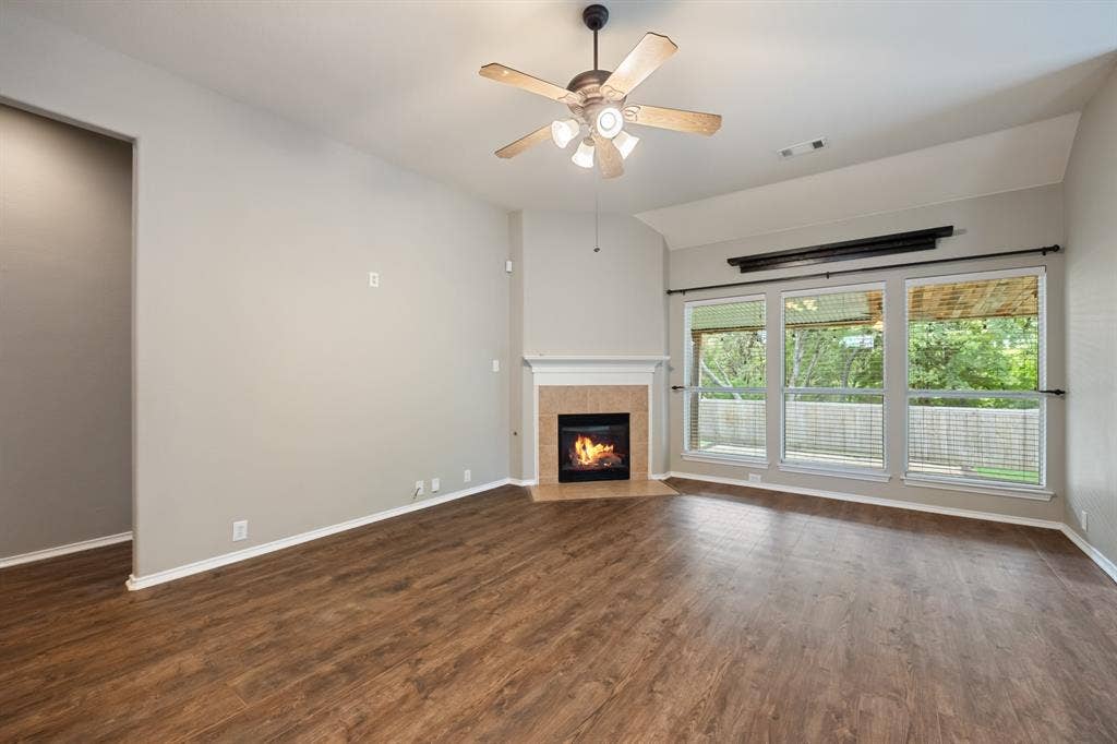 1275 Mission, Rockwall, TX 75087 Living room with fireplace and outdoor views