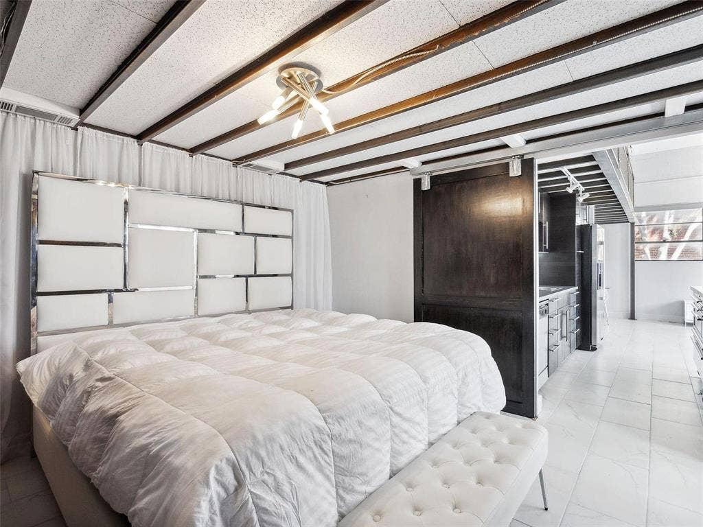 215 N Walton Street, #2, Dallas, TX 75226 Exposed beam ceiling with recessed lighting, dark wood sliding barn door, and large-format tile flooring