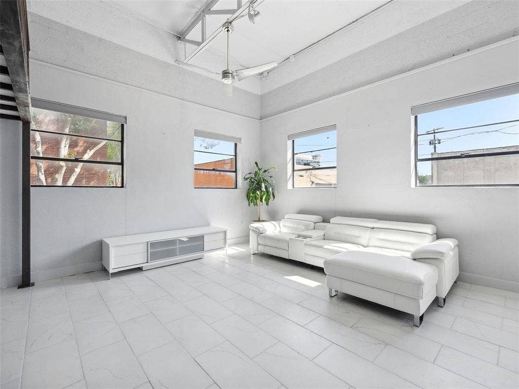 215 N Walton Street, #2, Dallas, TX 75226 High ceilings with exposed industrial truss, large multi-pane windows, and light-toned tile flooring