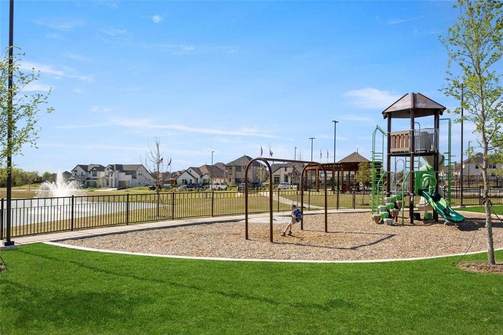 2808 Spring Side Drive, Royse City, TX 75189 Community recreational area featuring a playground with a tower structure and swings, a water fountain feature, and a pergola