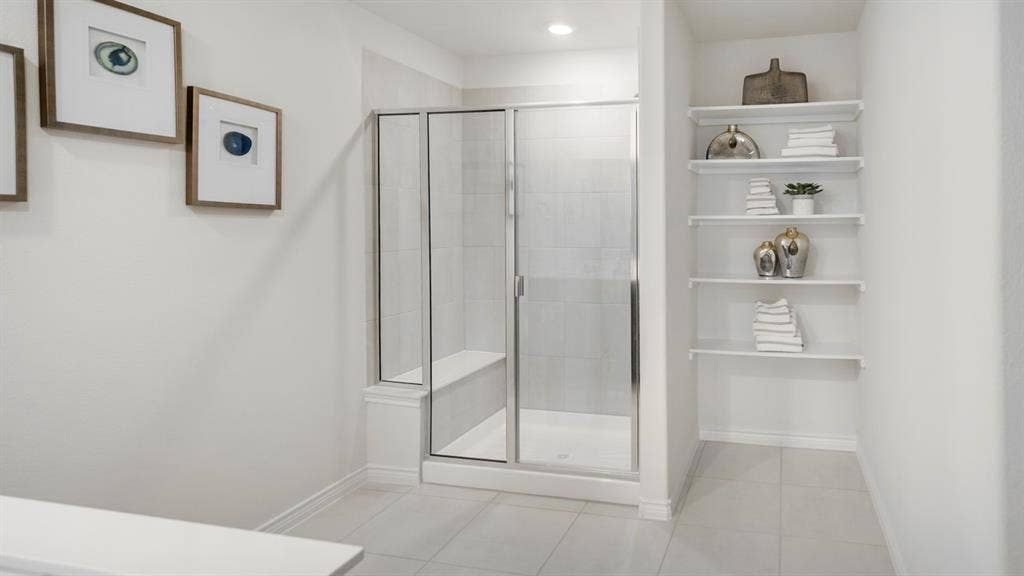 406 Campfield Drive, Caddo Mills, TX 75135 Glass-enclosed shower with a built-in bench and vertical tile surround