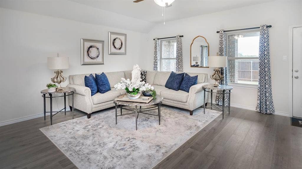 406 Campfield Drive, Caddo Mills, TX 75135 Spacious living area featuring wood-finish flooring, white walls, and multiple windows