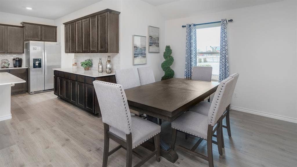 406 Campfield Drive, Caddo Mills, TX 75135 Open concept dining area featuring light wood-finish flooring