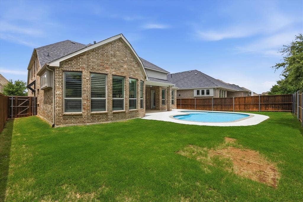 Grass area for playground, pets, or extra large Texas kitchen and covered patio! Endless possibilities!