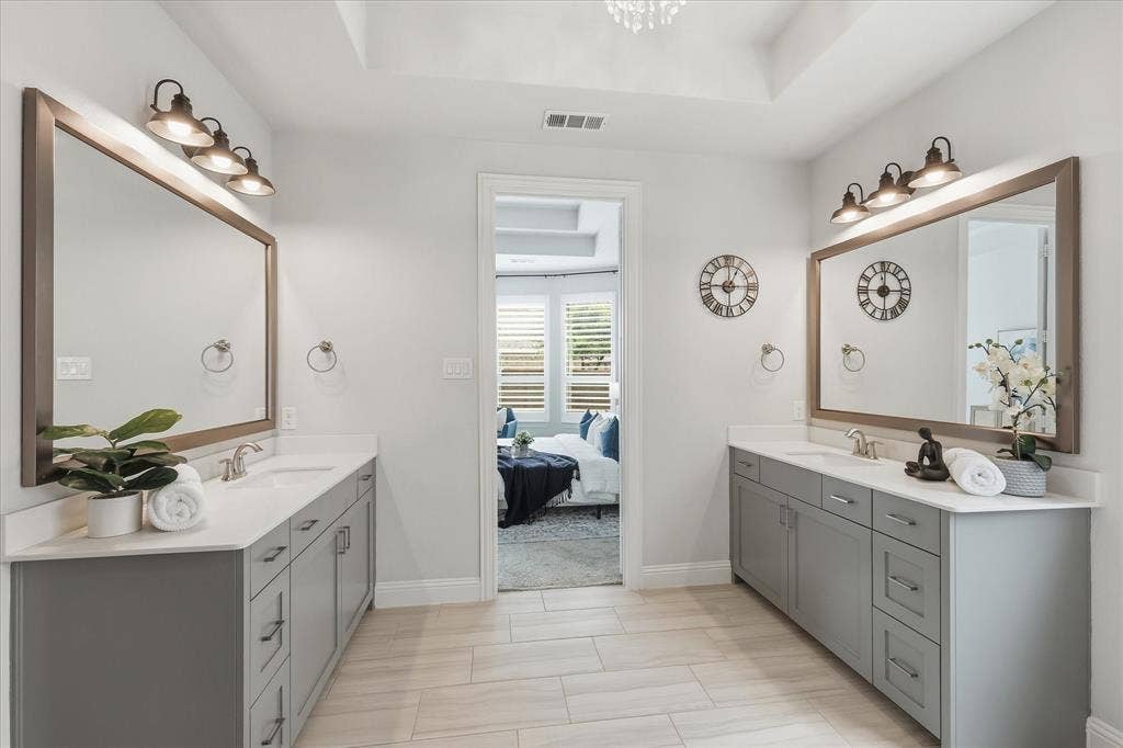 Dual vanities and xlarge mirrors in the primary bathroom!