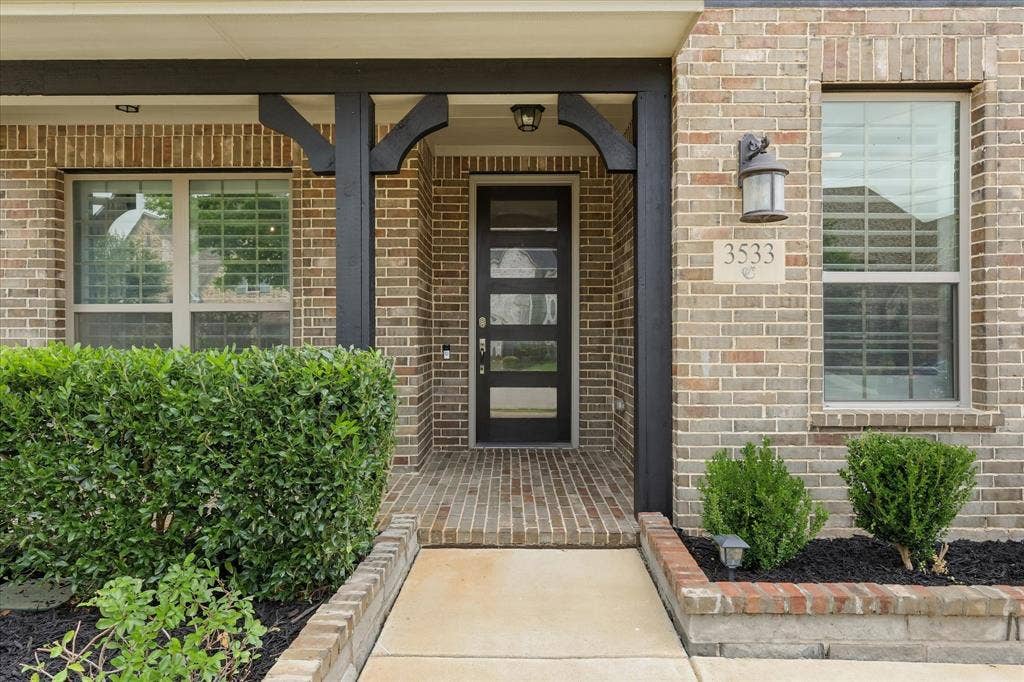 Inviting entry way with porch, bring the rocking chairs!