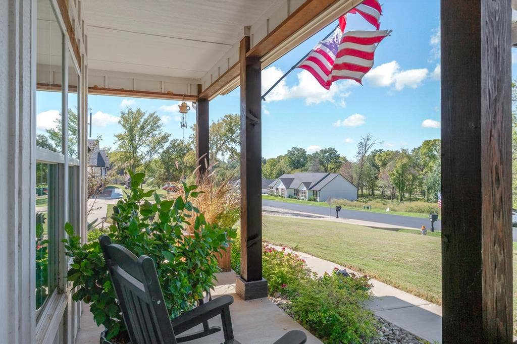 203 Splitrail Drive, Mabank, TX 75143 Covered front porch featuring exposed timber posts and a concrete floor
