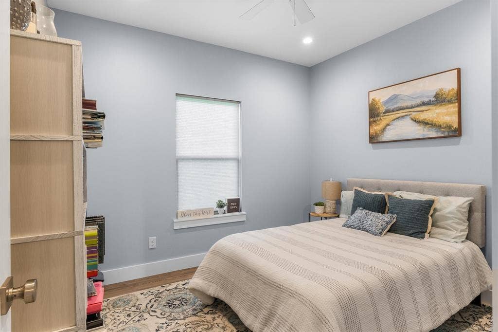 203 Splitrail Drive, Mabank, TX 75143 Room featuring light-toned interior paint, wood-finish flooring, ceiling fan, and a deep-set window ledge