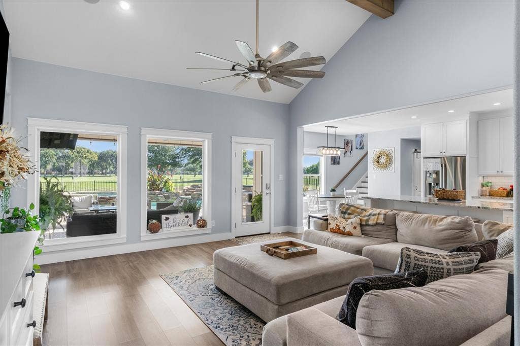 203 Splitrail Drive, Mabank, TX 75143 Vaulted ceilings, wood-finish flooring, recessed lighting, multi-pane windows, and a ceiling fan