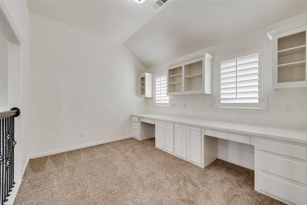Upstairs home office with 2 built-in desks and shelving. Great for office, homework or crafting.