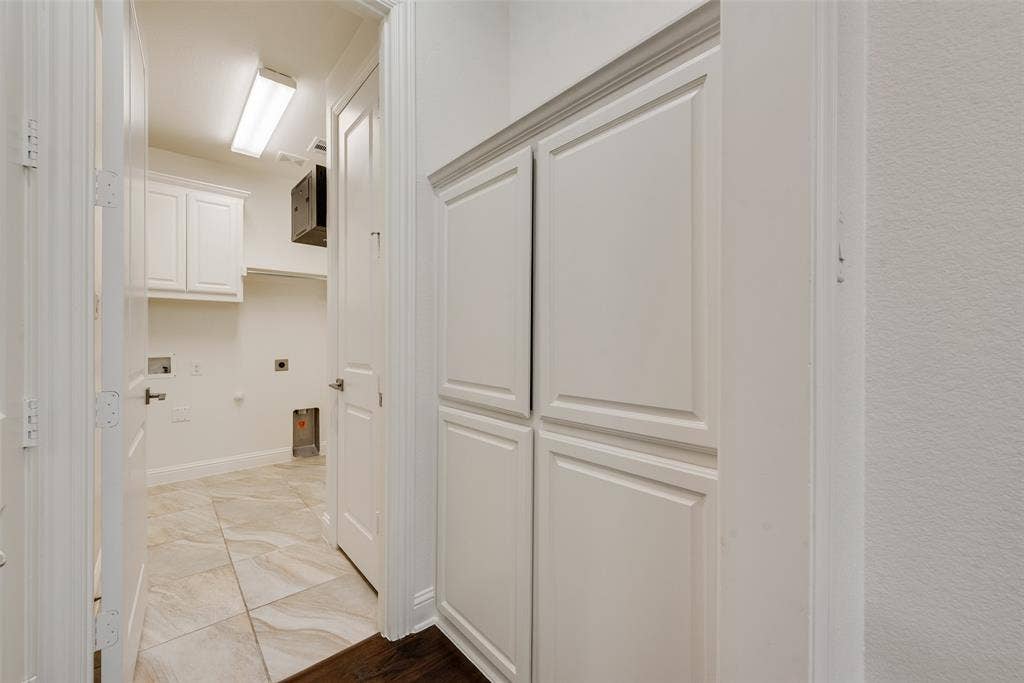 Ample storage cabinets located inside, near the garage door and the laundry.