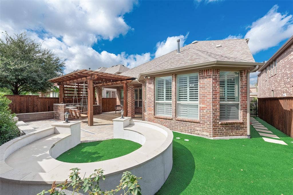 Concrete sitting area with plenty of space for your own fire pit.  Fully turfed backyard means maintenance free!