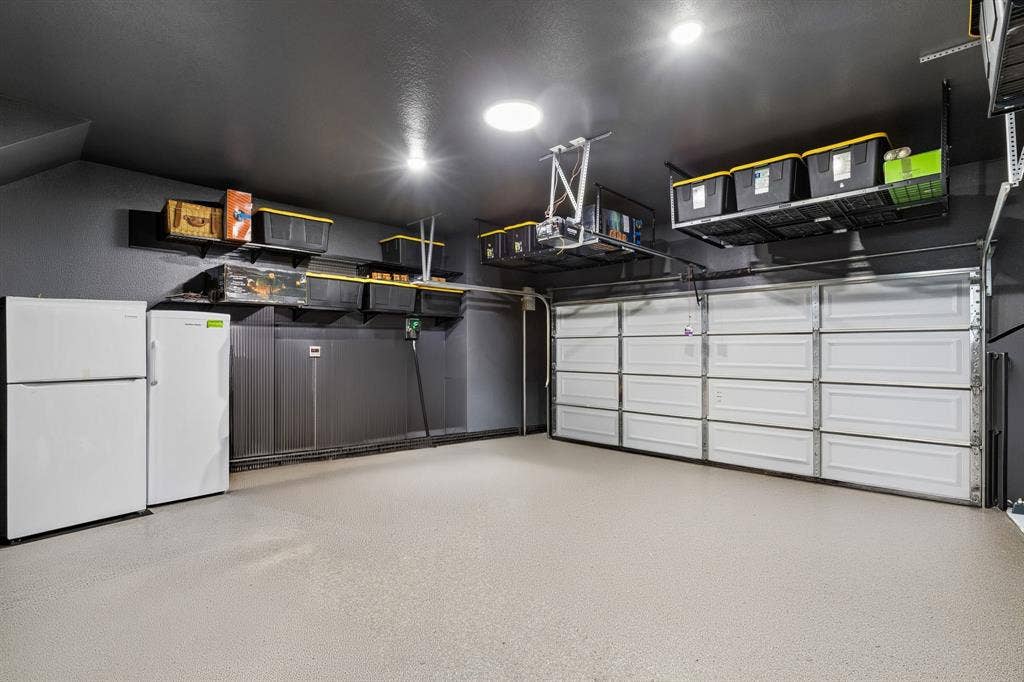 4308 Henderson Avenue, North Richland Hills, TX 76180 Garage Has Epoxy Flooring, Upgraded Lighting and Multiple Storage Racks that Convey