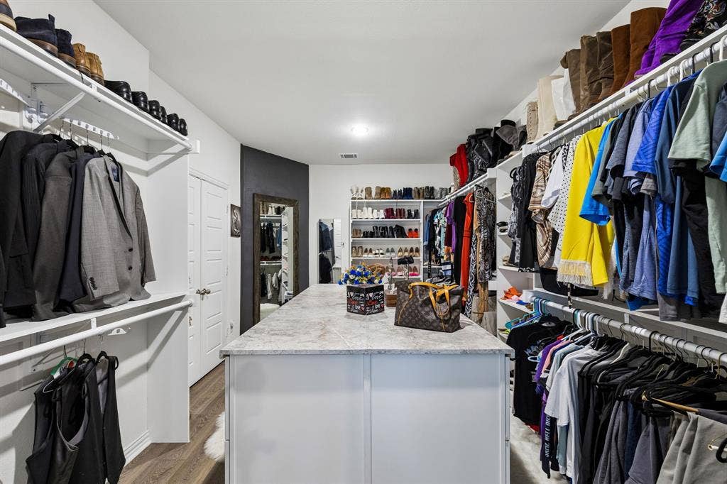 4308 Henderson Avenue, North Richland Hills, TX 76180 8-Foot Island in Primary Bedroom Closet with storage drawers on both sides!