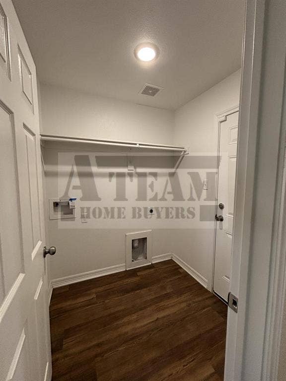 Utility room featuring wood-finish flooring, recessed ceiling lighting, and built-in overhead shelving