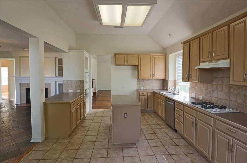View of kitchen and living room from the breakfast area.