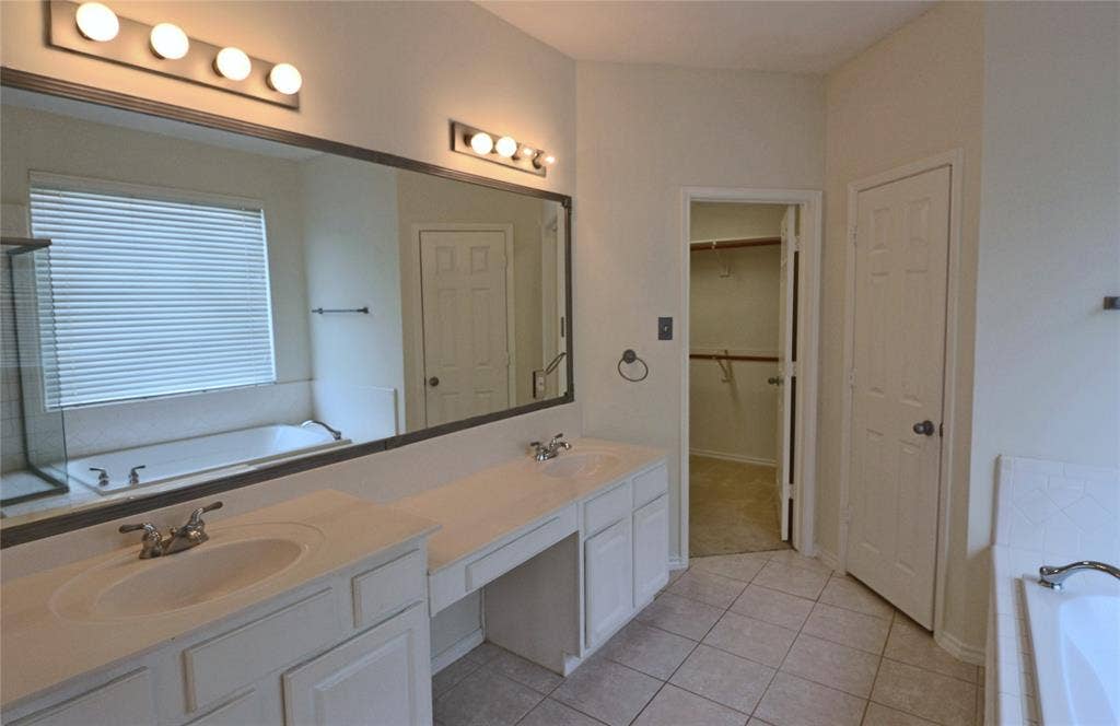 Primary bathroom opens to the large walk in closet