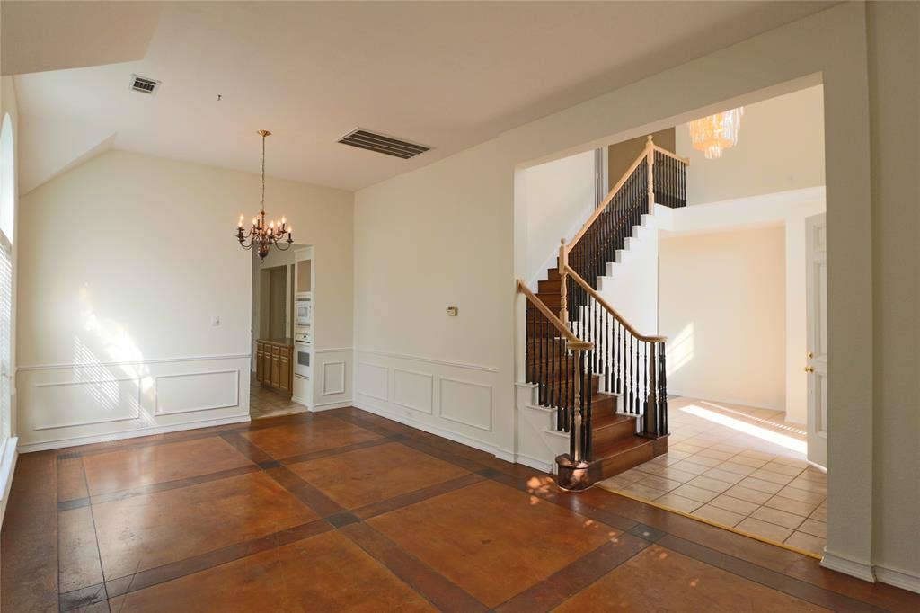 Oversized dinning room featuring concreted flooring.