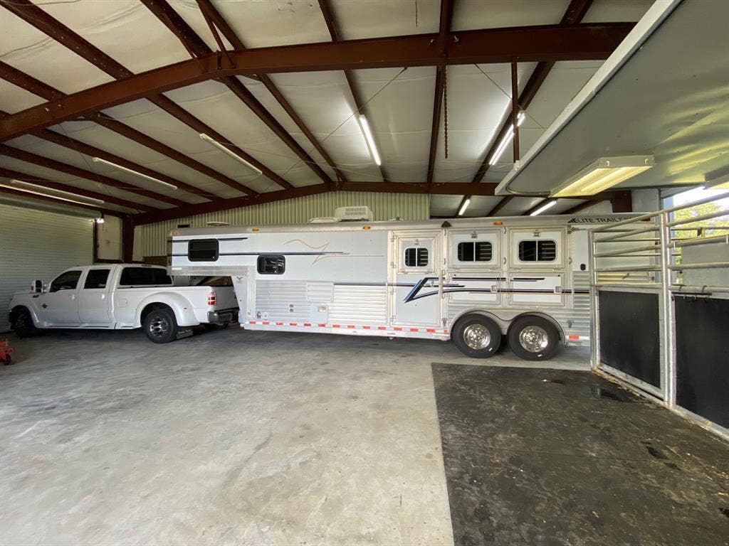 Trailer and truck fit in middle of barn with 50 Amp hookup