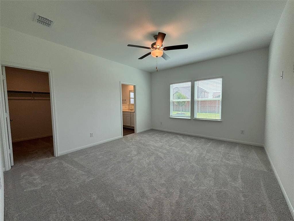 Large primary bed with lovely views of backyard