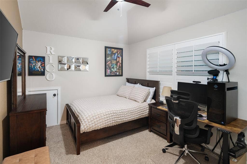 Vaulted ceiling, ceiling fan, and plantation shutters