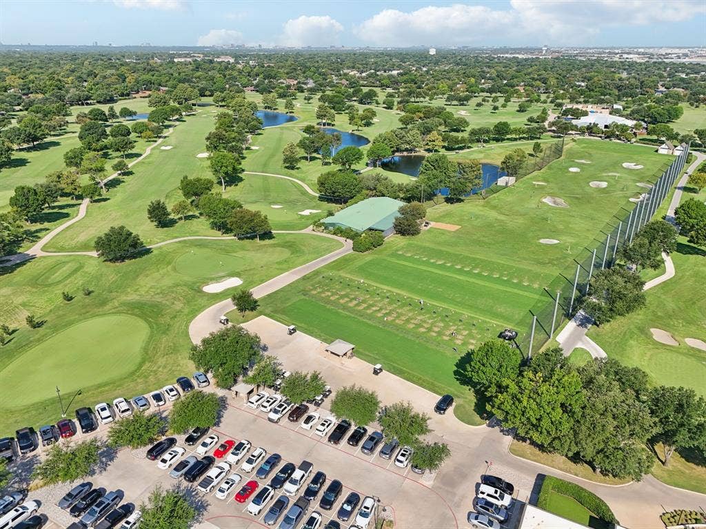 4008 Fairlakes Drive, Dallas, TX 75228 Expansive golf course featuring a driving range, multiple greens, sand traps, and water features