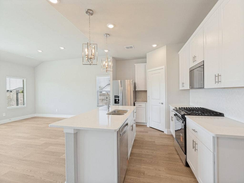 1411 Buck Run Drive, McKinney, TX 75071 Inviting Kitchen Island