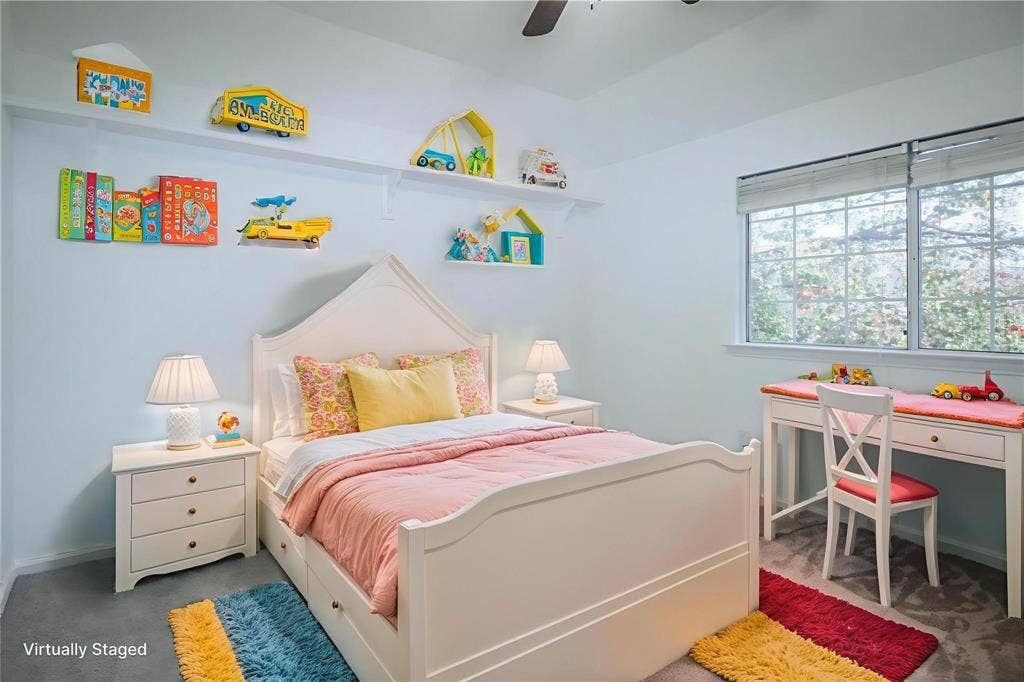 504 Renfro Court, Irving, TX 75063 Bedroom featuring neutral wall-to-wall carpeting, vaulted ceilings with an integrated overhead fan, and a grid-style window