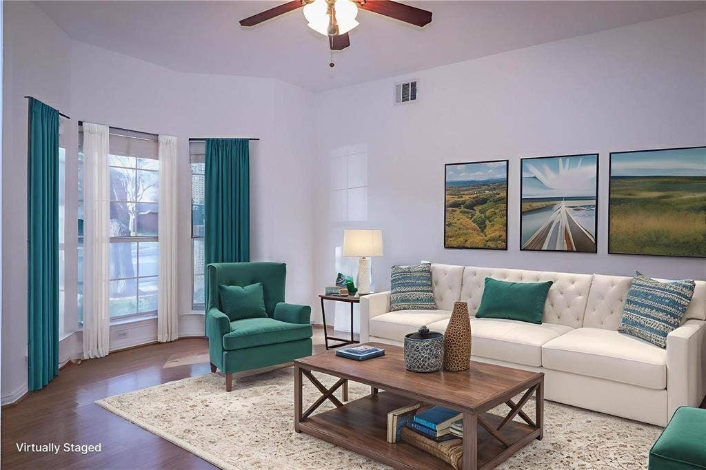 504 Renfro Court, Irving, TX 75063 Living area featuring a bay window, wood-finish flooring, and a ceiling fan with integrated lighting