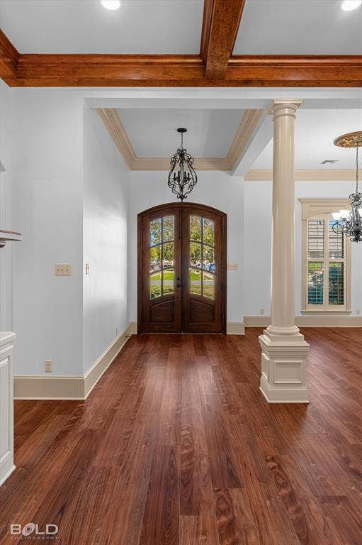 718 Duckwater Landing, Bossier City, LA 71111 Foyer featuring stained wood-finish flooring, double arched glass-panel doors, decorative stained wood ceiling beams, a classic fluted column, and recessed tray ceiling detailing