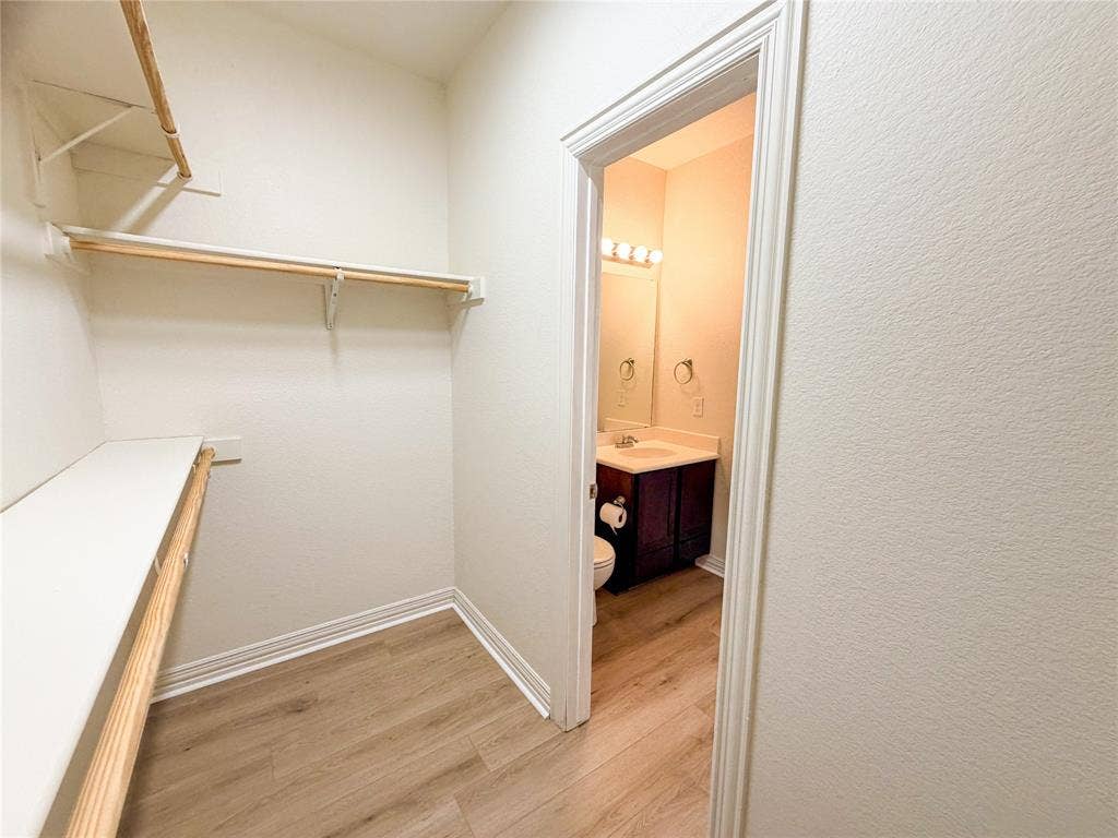 2410 S 2nd Street, #1373, Waco, TX 76706 Walk-in closet with built-in shelving and hanging rods