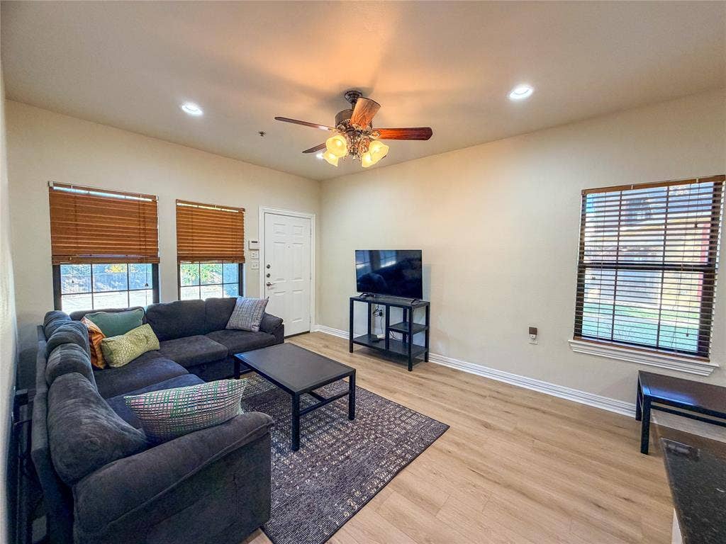 2410 S 2nd Street, #1373, Waco, TX 76706 Recessed lighting, wood-finish flooring, ceiling fan, and multiple windows with blinds