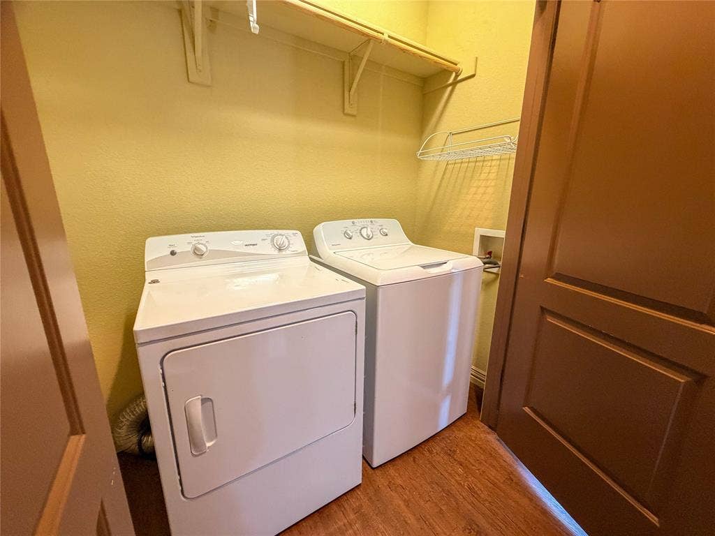 2410 S 2nd Street, #1373, Waco, TX 76706 Dedicated laundry area featuring a white top-load washing machine and a white front-load dryer