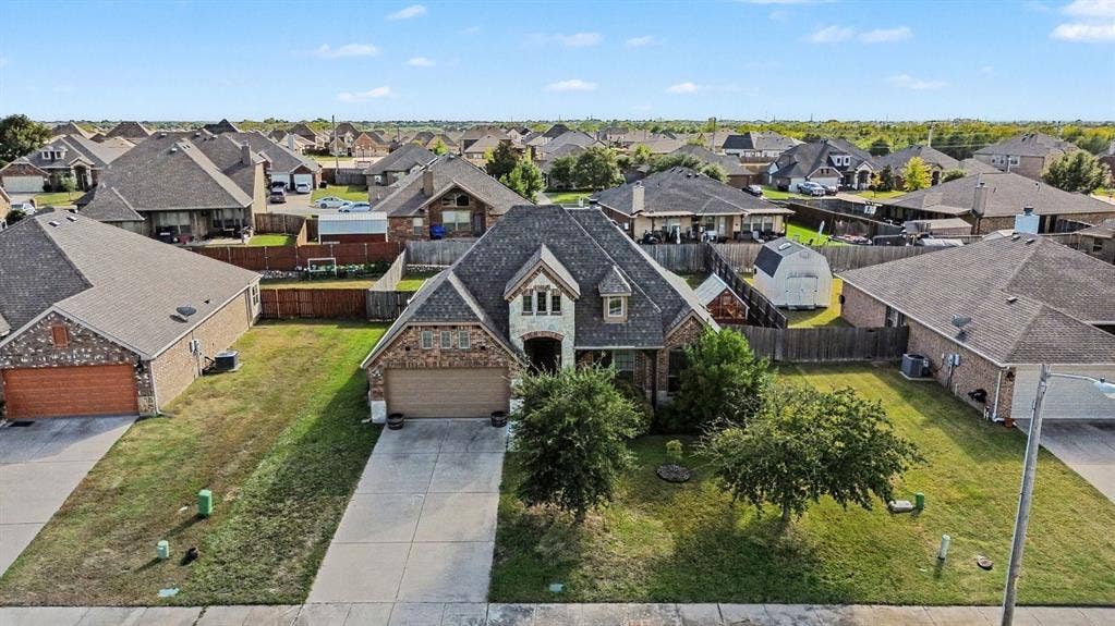 1005 Seminole Lane, Greenville, TX 75402 An elevated view of the welcoming front exterior.