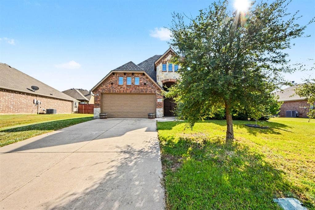 1005 Seminole Lane, Greenville, TX 75402 A welcoming arrival in The Cedars.