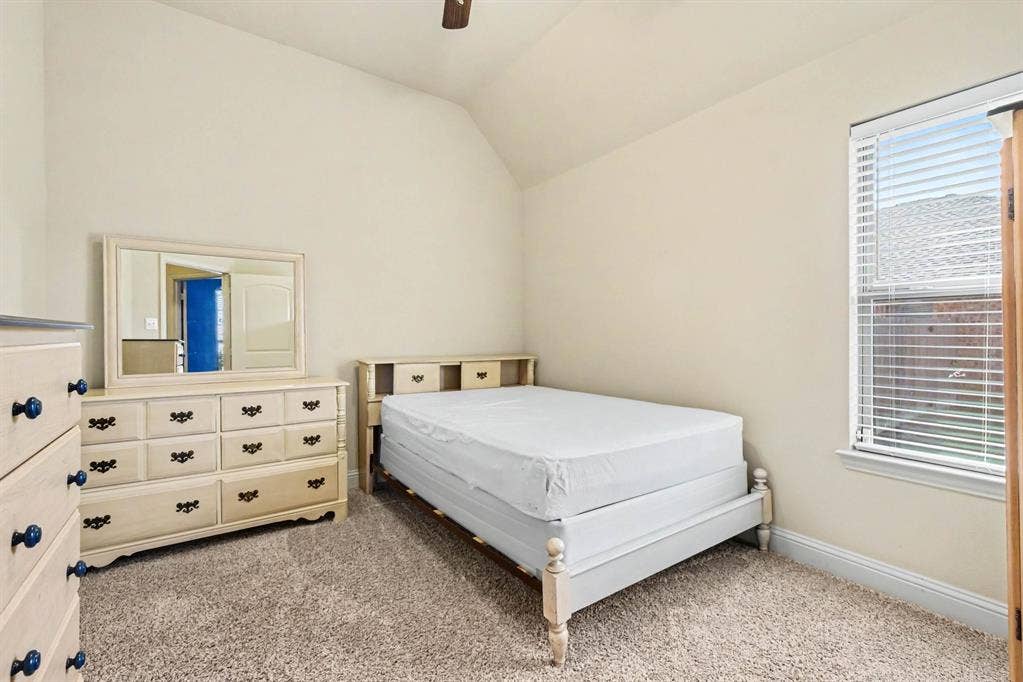 1005 Seminole Lane, Greenville, TX 75402 A restful bedroom with soft natural light.