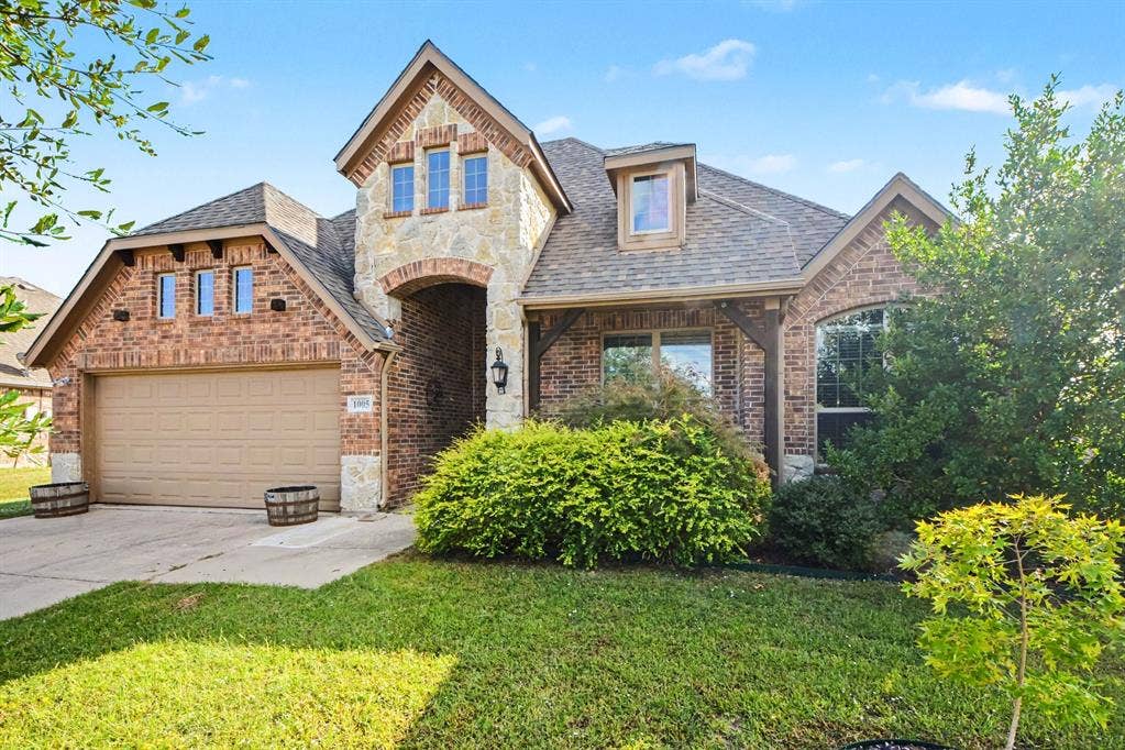 1005 Seminole Lane, Greenville, TX 75402 Classic brick and stone curb appeal.