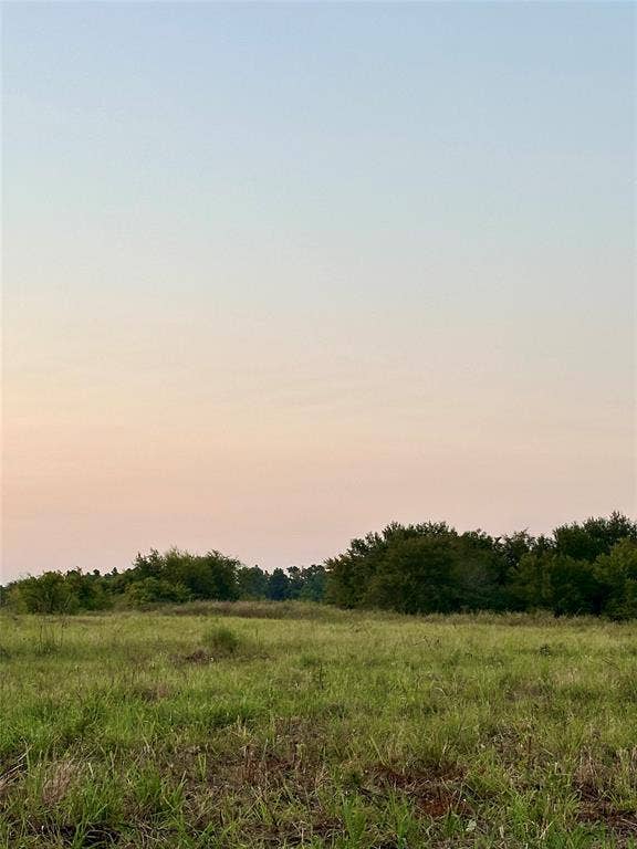 Nature at dusk featuring a view of rural / pastoral area