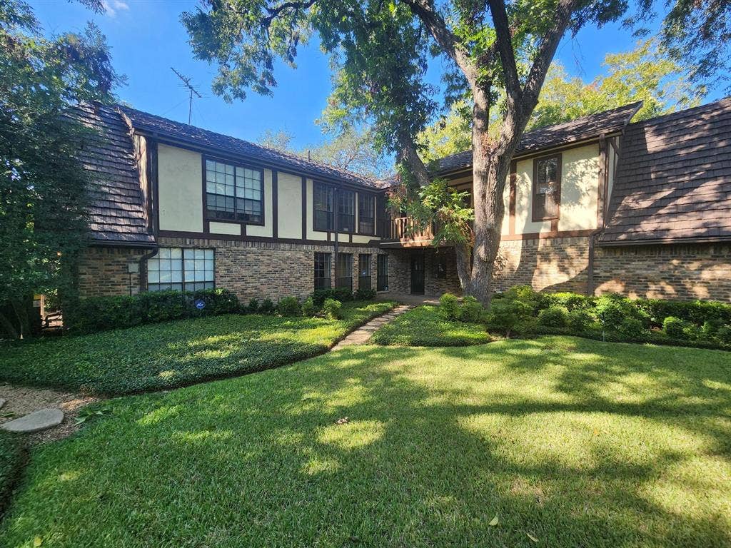 6510 Covecreek Place, Dallas, TX 75240 Beautiful back yard and view of home with covered patio and balcony.