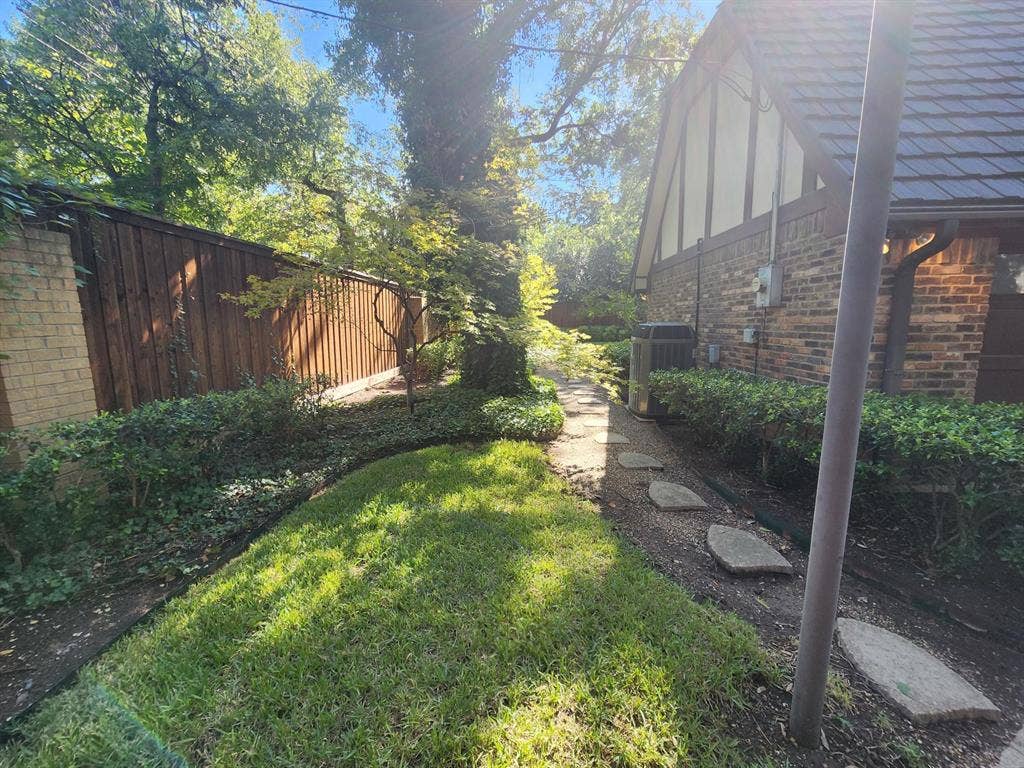 6510 Covecreek Place, Dallas, TX 75240 Walk around to the backyard from the driveway.
