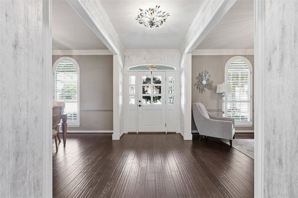 Large entry hall between formal living and dining