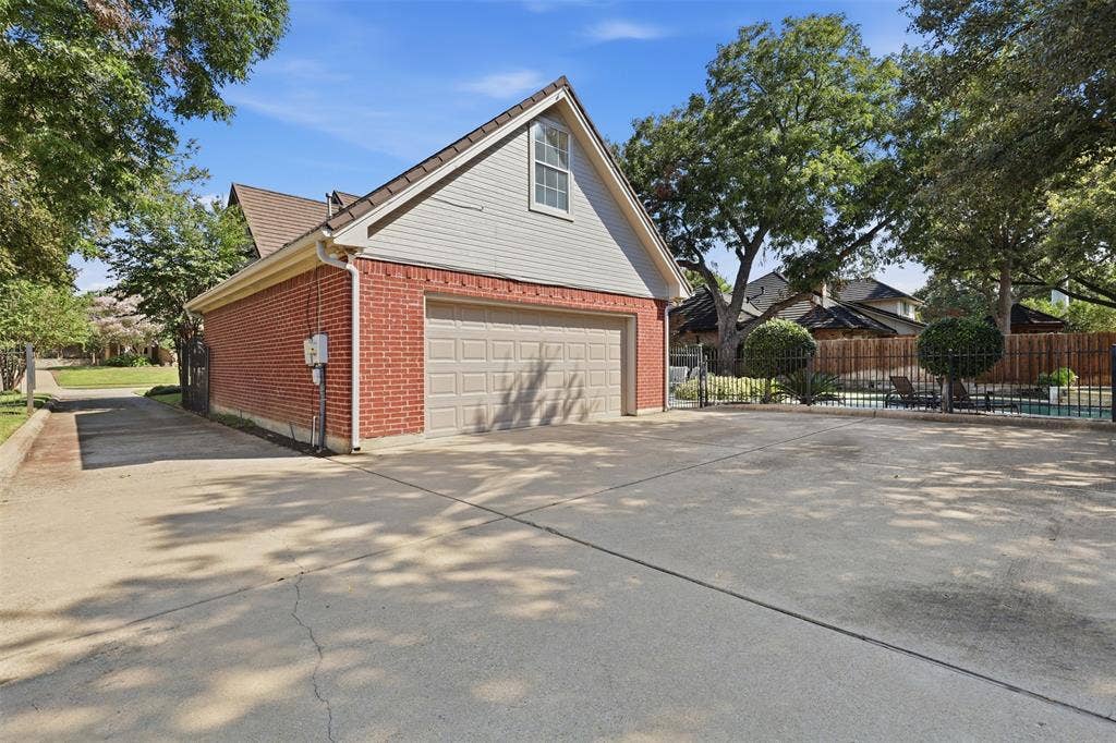 Oversized garage with lots of storage and extra parking in rear