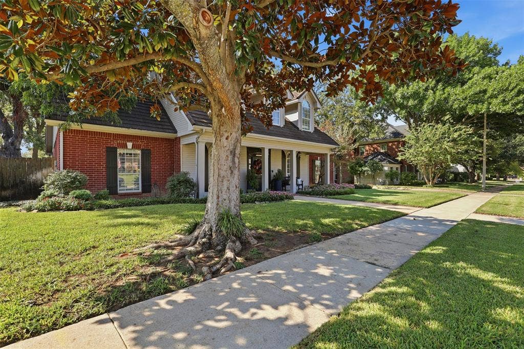 Enchanted Lake Estates has sidewalks & mature trees on this cul de sac lot