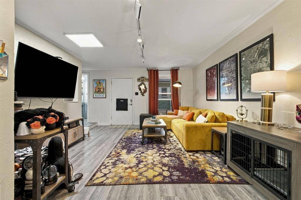 4904 Lahoma Street, #4904, Dallas, TX 75235 Living area featuring wood-finish flooring, adjustable track lighting, and a square recessed ceiling light