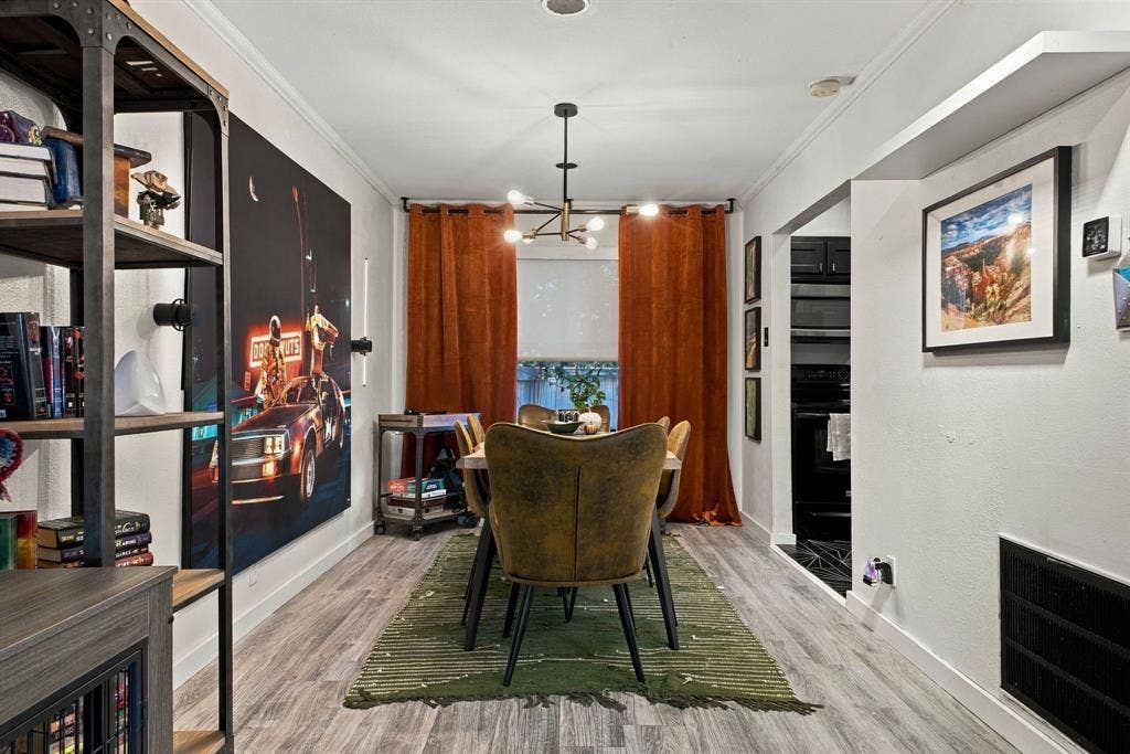 4904 Lahoma Street, #4904, Dallas, TX 75235 Wood-finish flooring, multi-arm metal chandelier, and recessed display shelving
