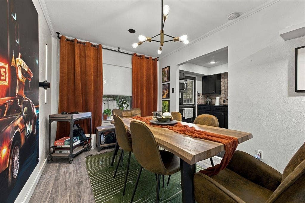 4904 Lahoma Street, #4904, Dallas, TX 75235 Modern multi-arm chandelier with gold-finish detailing and wood-finish flooring