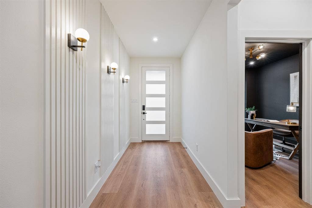 2719 Andrea Lane, Dallas, TX 75228 Elegant sconce lighting upon entry.