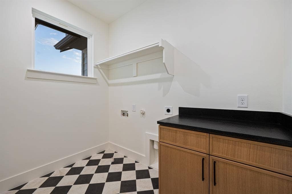 2719 Andrea Lane, Dallas, TX 75228 Checkered tile in the laundry room.